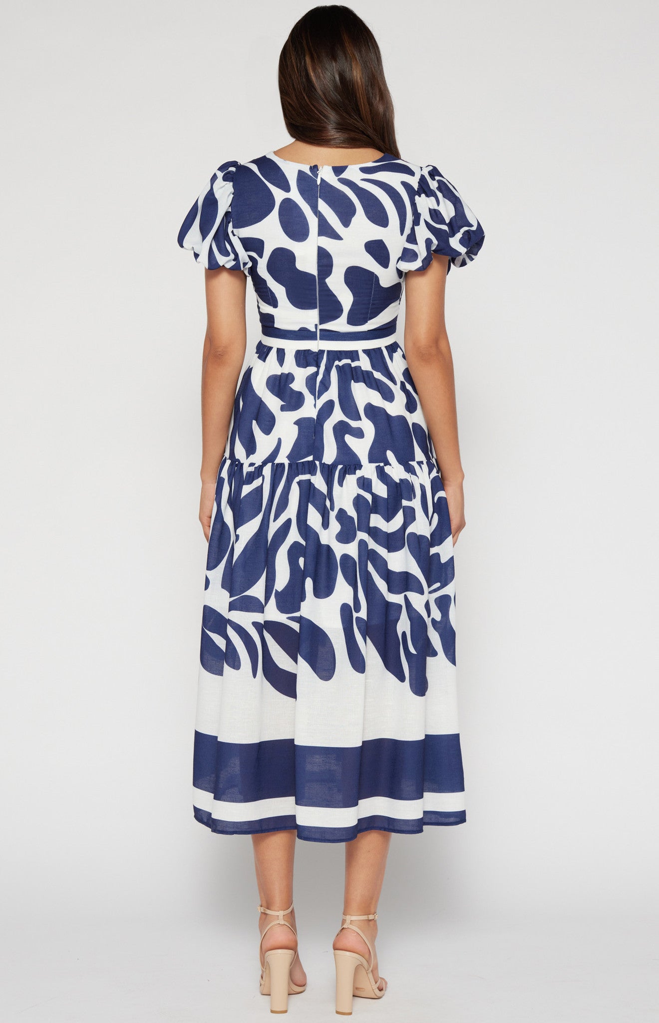 Navy blue midi-length dress, fitted at the bodice for a flattering silhouette